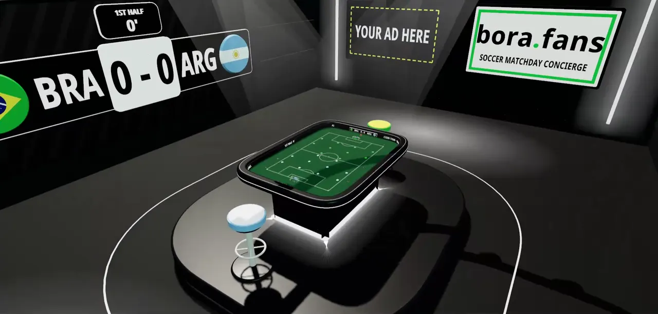 A sala de esports, com a mesa debaixo das luzes